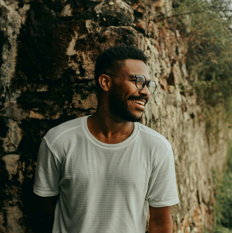 Smiling Man Wearing Glasses Outdoors