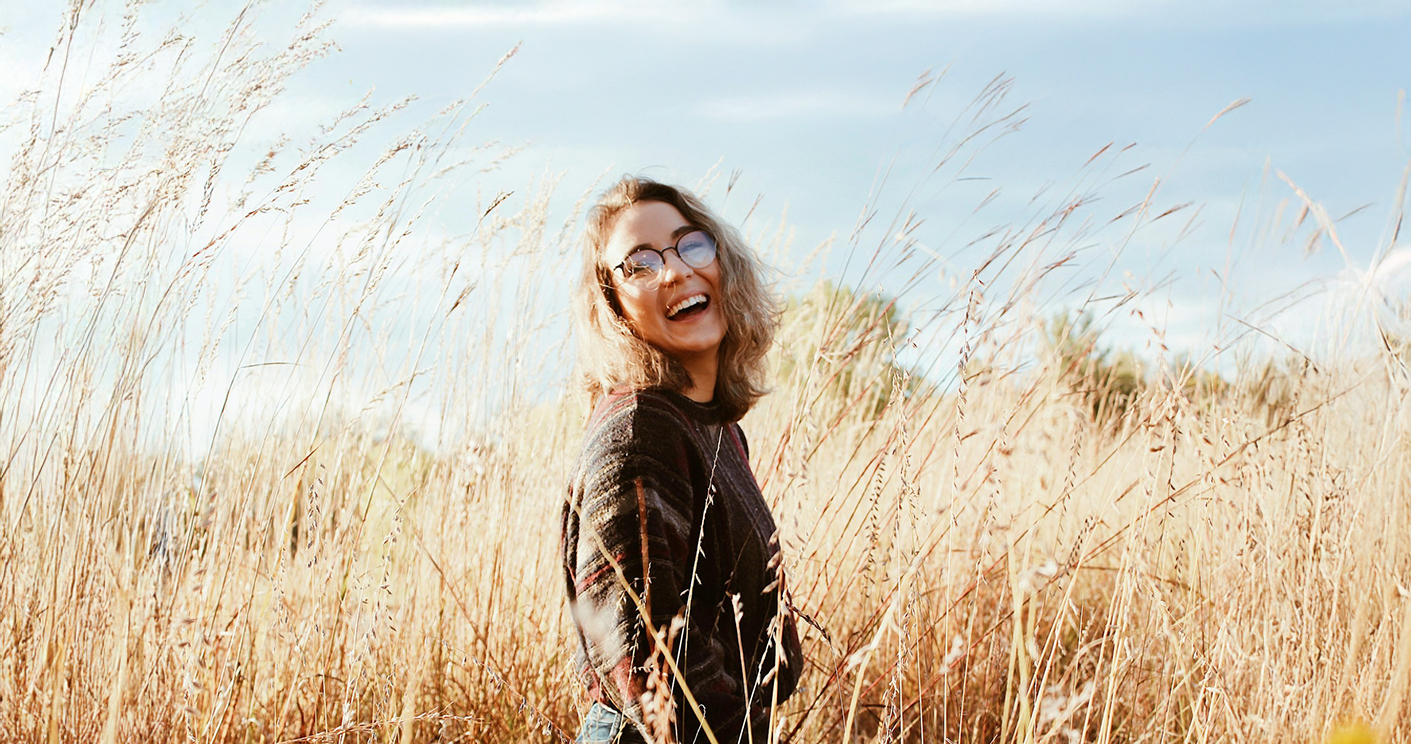 Happy Woman In A Field