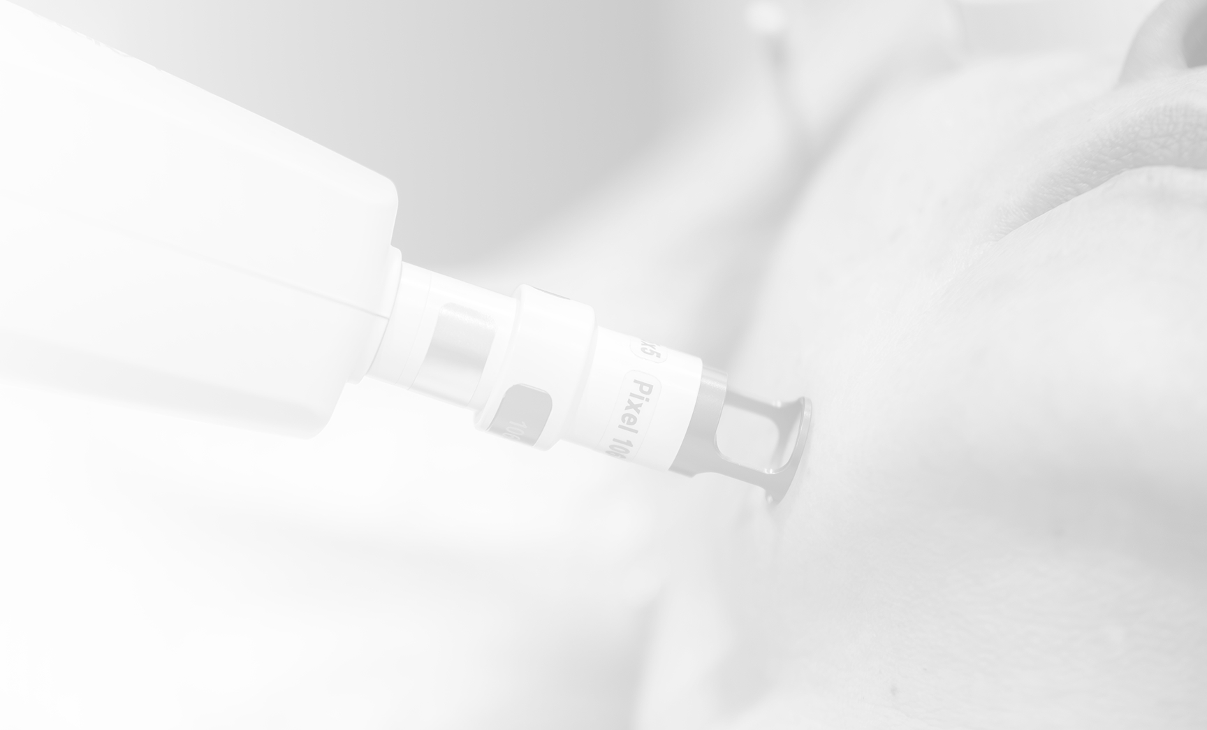 showing a close-up of a laser or IPL (Intense Pulsed Light) treatment being performed on a patient's face.